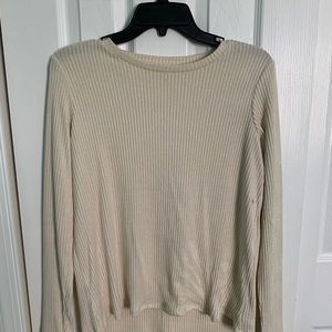 Cream colored long sleeve top